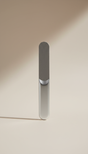A centered, straight-on view of a travel-friendly nail file, showcasing its refined design and compact form. The file is...