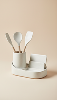 A centered image of a ceramic kitchen organizer from Urban Oasis, set against a light beige background. The product's...