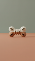 Interactive silicone pet toy, Default to 3/4 table-level angle for dimensionality—products rest on tactile surfaces (linen...
